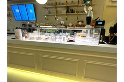 What should be considered when buying a refrigerated display cabinet?